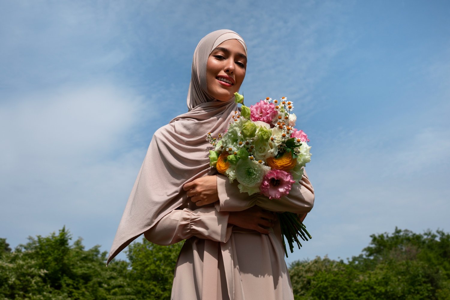 medium-shot-muslim-woman-posing-with-flowers (2)